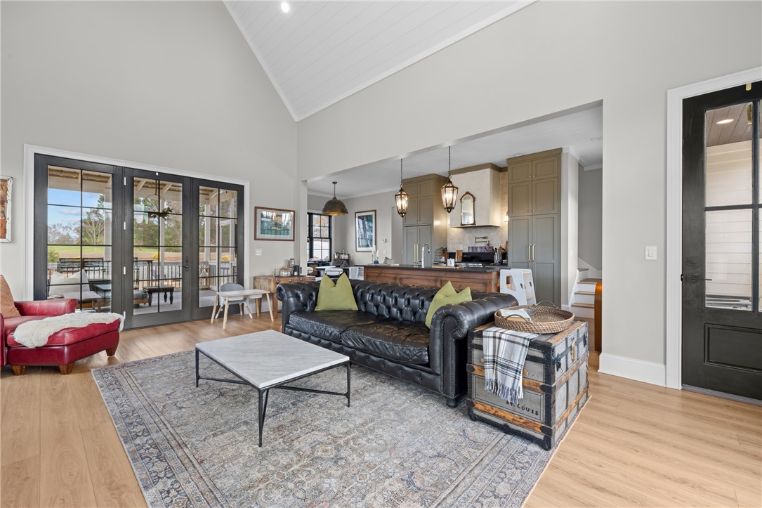 677 Lightwood Road Hartwell, GA 30643 - Photo 4 of 42 An inviting open-concept living area boasts abundant natural light and seamless kitchen access.