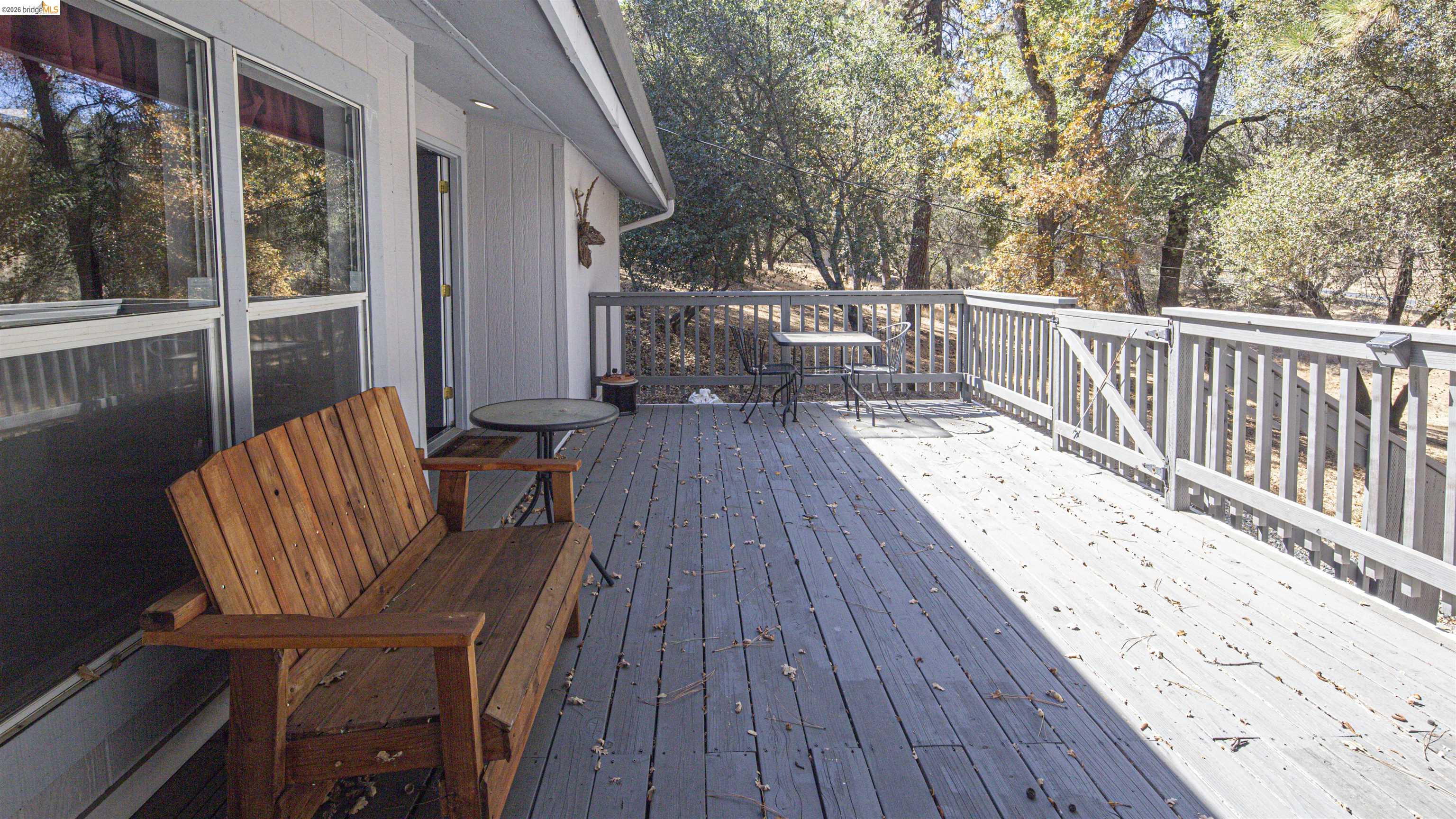 19327 Ferretti Road Groveland, CA 95321 - Photo 13 of 44 Expansive outdoor deck with wood-finish decking and perimeter railing