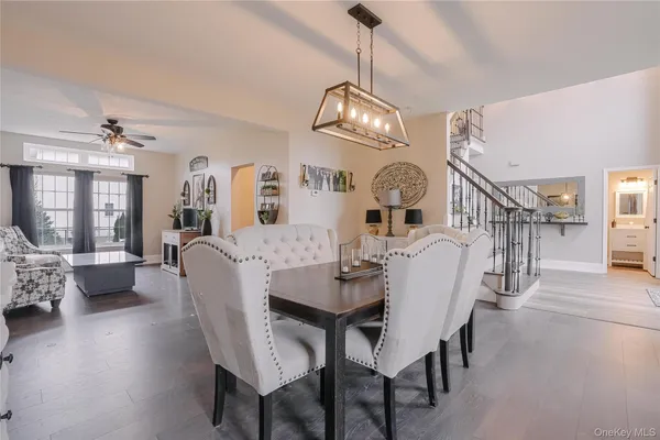 a view of a dining room with furniture wooden floor and chandelier