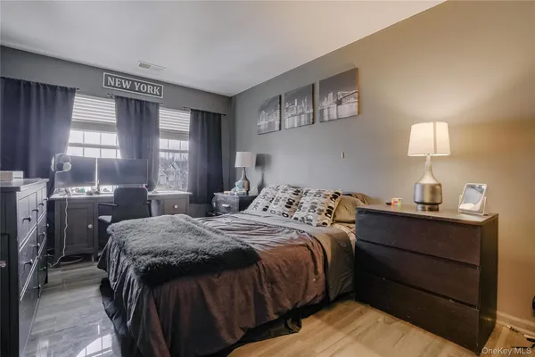 a bedroom with a bed and window