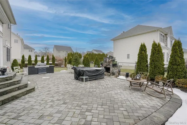 a view of a patio with couches and potted plants