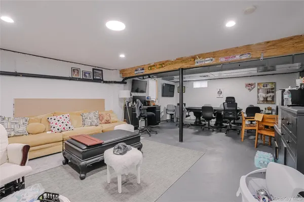 a living room with furniture and gym equipment