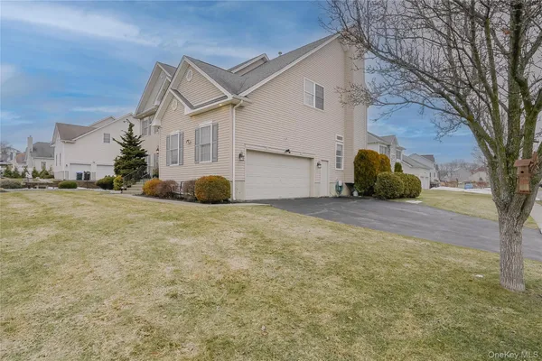 a view of a house with a snow in front of a house