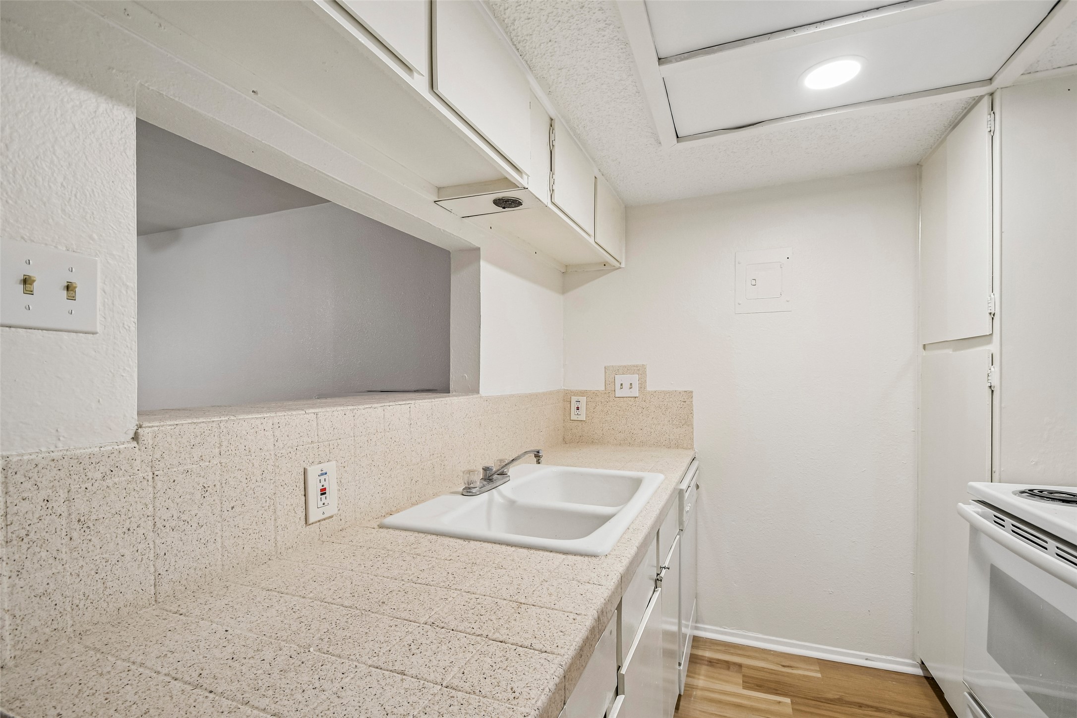2413 Leon Street, Unit 104 Austin, TX 78705 - Photo 12 of 26 a bathroom with a sink and a mirror