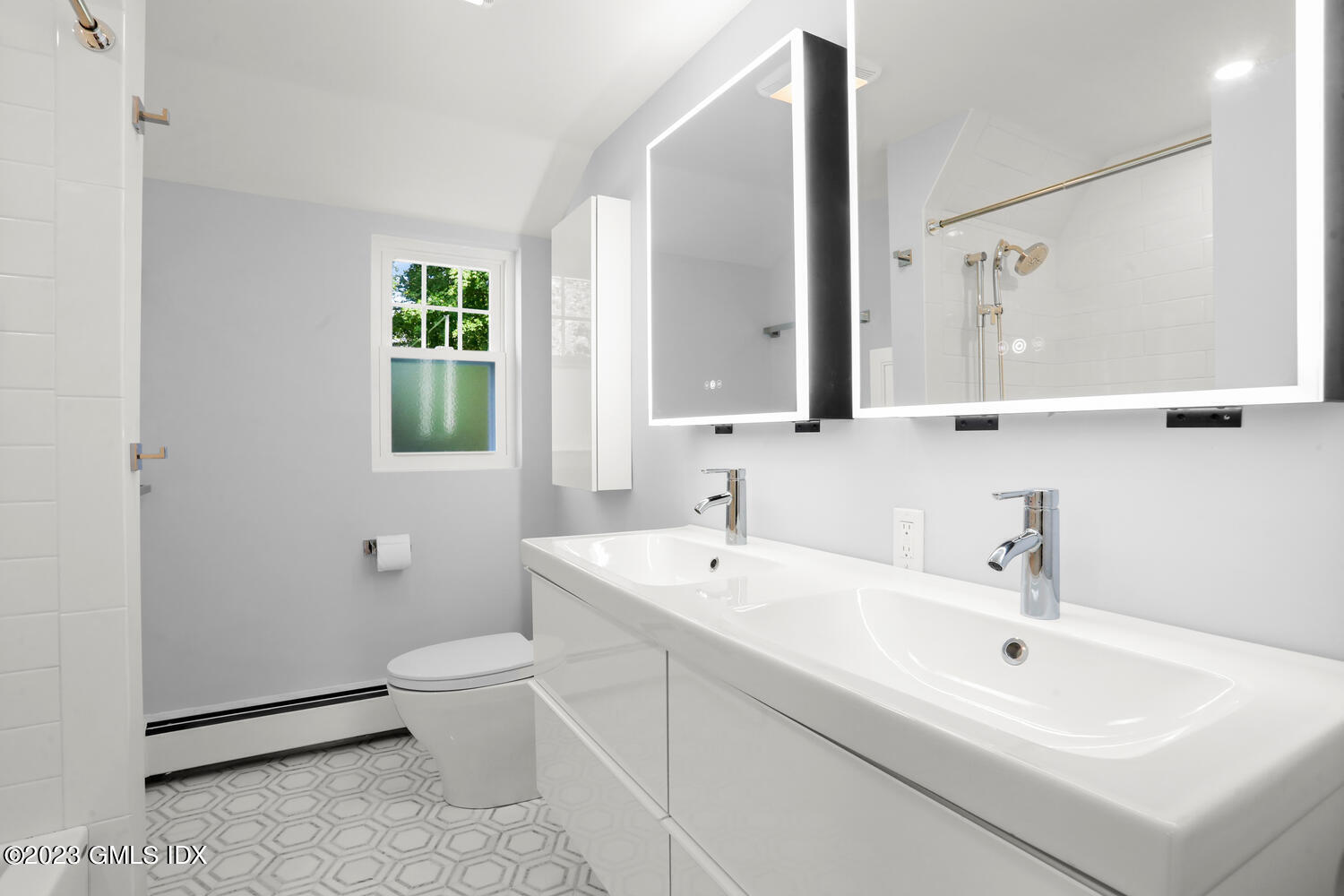 20 Cross Lane Cos Cob, CT 06807 - Photo 11 of 24 a bathroom with a white sink a toilet and a mirror