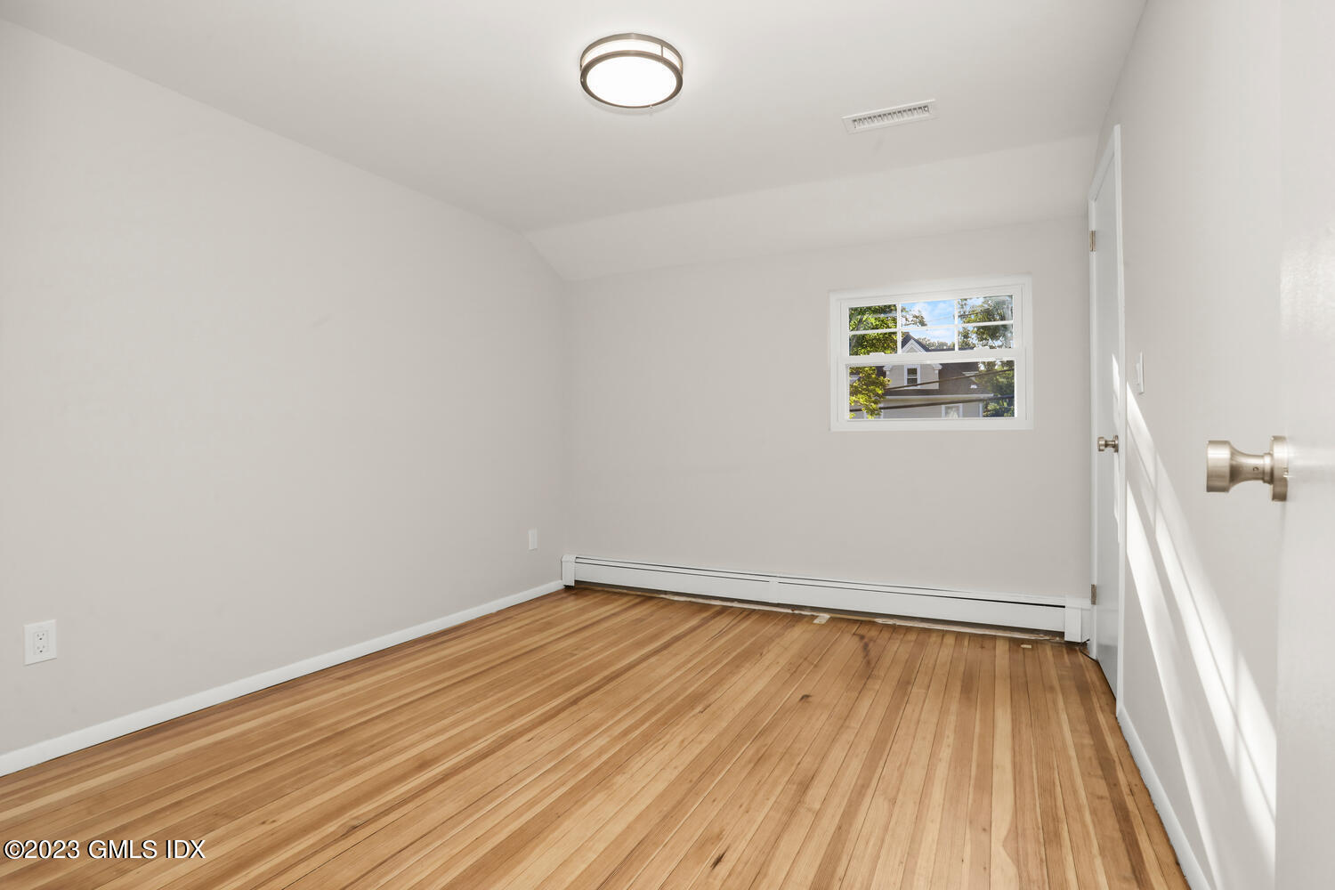 20 Cross Lane Cos Cob, CT 06807 - Photo 12 of 24 a view of a room with wooden floor and window