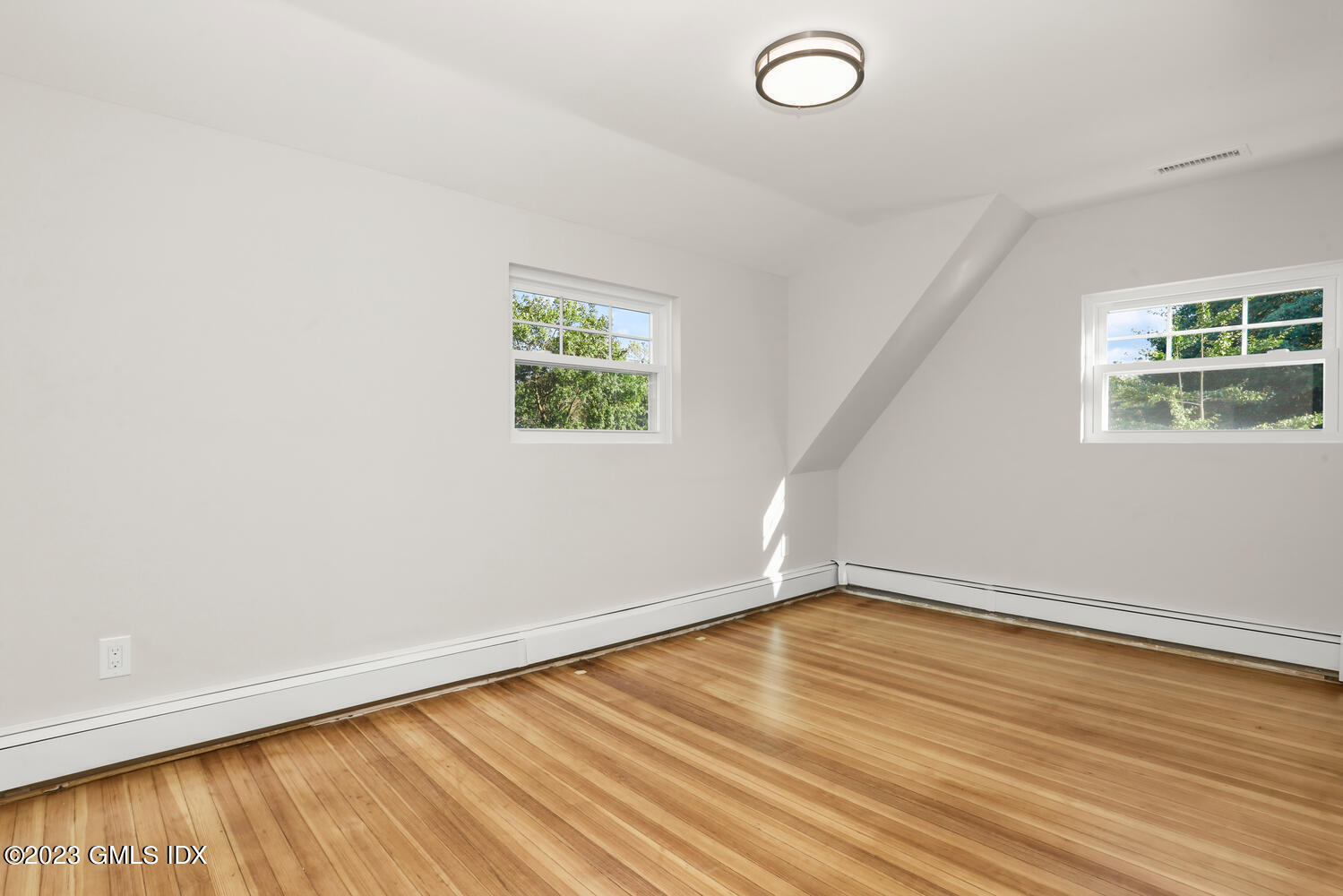 20 Cross Lane Cos Cob, CT 06807 - Photo 13 of 24 an empty room with wooden floor and windows