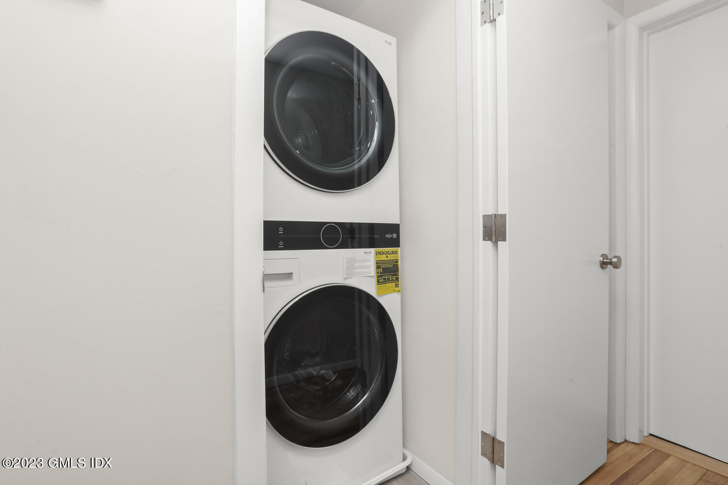 20 Cross Lane Cos Cob, CT 06807 - Photo 15 of 24 a view of a hallway with washer and dryer