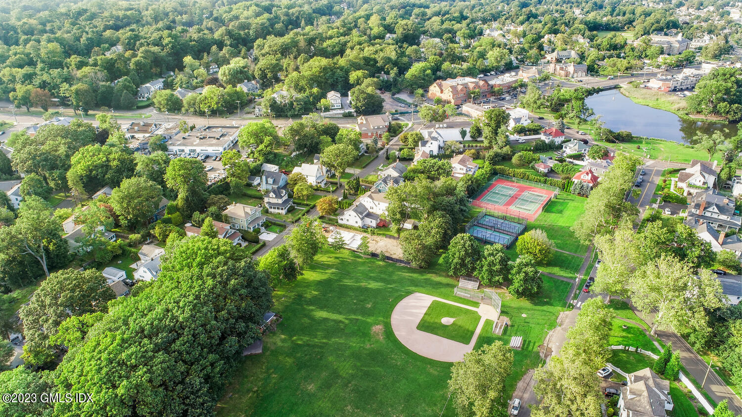 20 Cross Lane Cos Cob, CT 06807 - Photo 20 of 24 a view of a house with a tree in a backyard