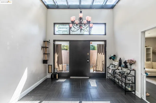 a view of an entryway with wooden floor