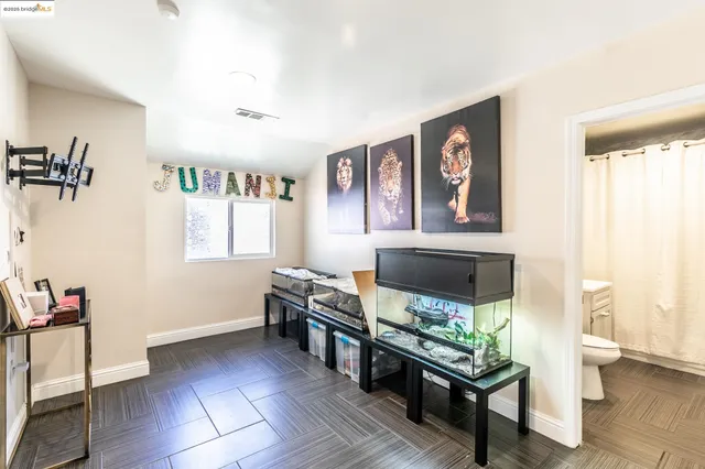 a bedroom with bed and window