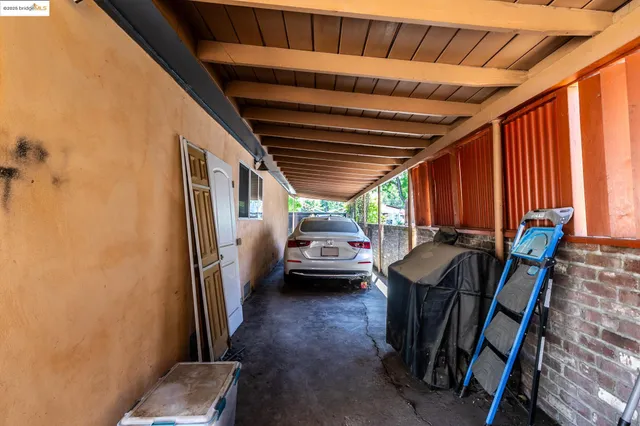 a view of a porch with chairs and floor