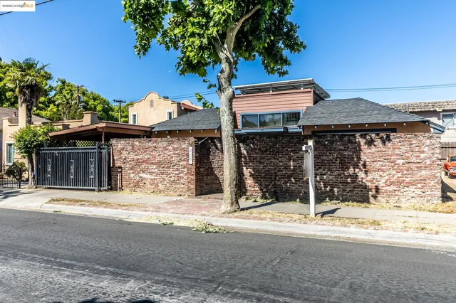 a view of a door and brick wall