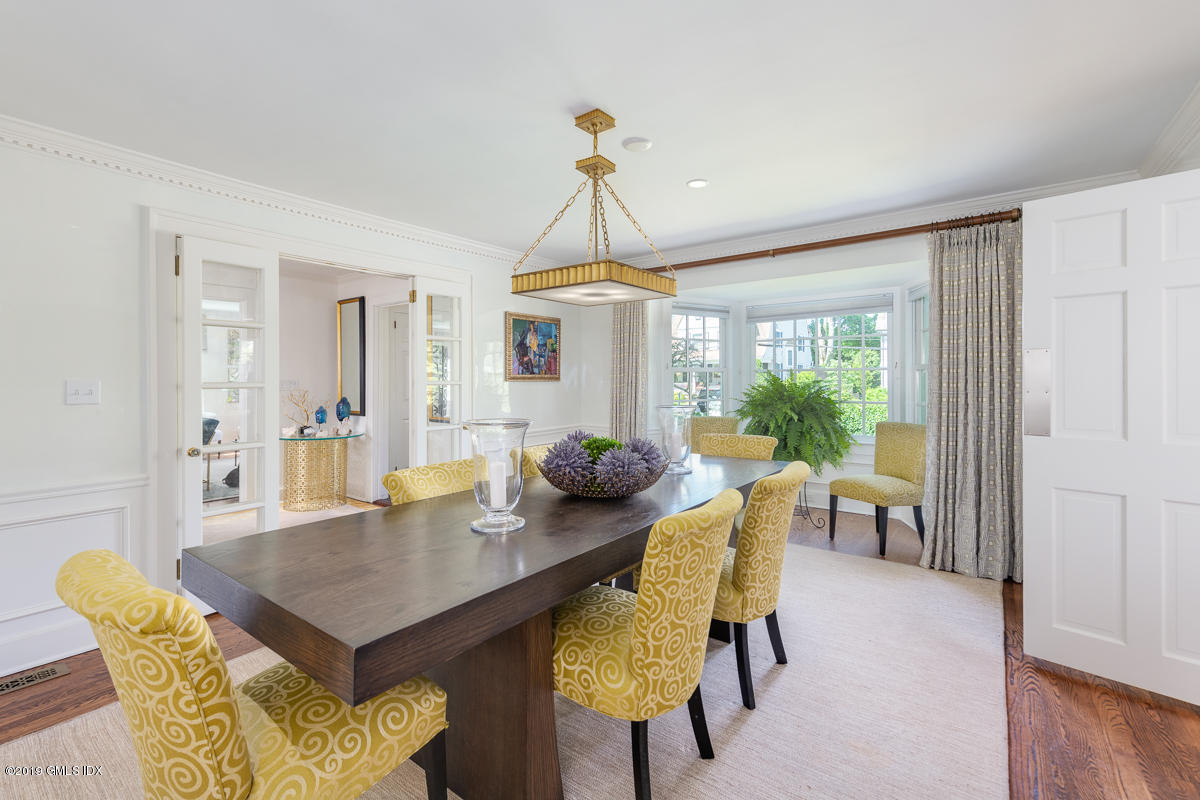 23 Maher Avenue Greenwich, CT 06830 - Photo 13 of 51 a view of a dining room with furniture window and wooden floor
