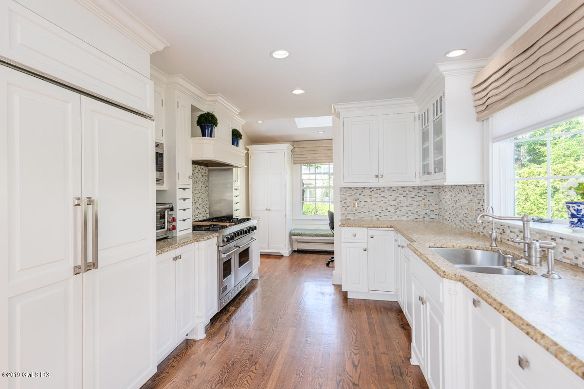 23 Maher Avenue Greenwich, CT 06830 - Photo 17 of 51 a large kitchen with stainless steel appliances granite countertop a lot of counter space and wooden floors