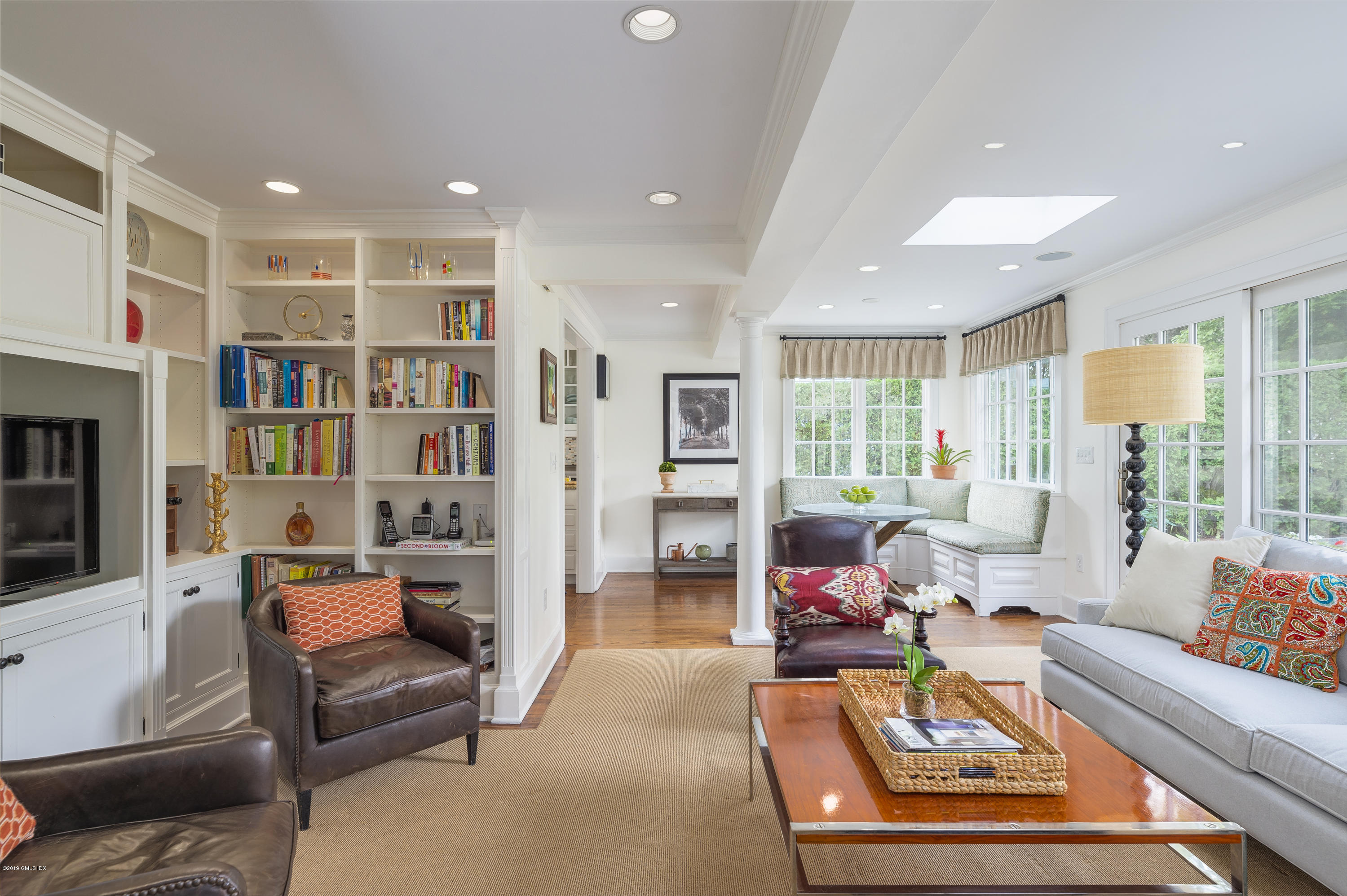 23 Maher Avenue Greenwich, CT 06830 - Photo 21 of 51 a living room with furniture or couch and a bookshelf