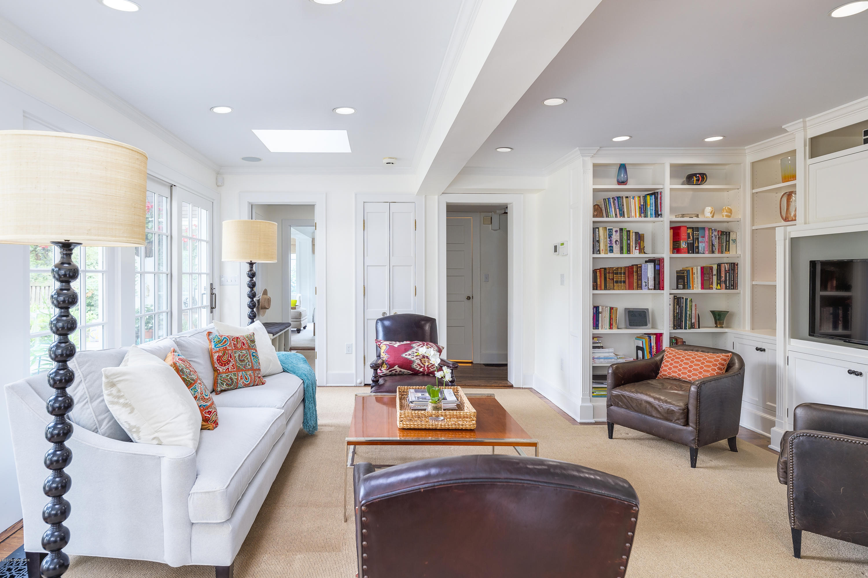 23 Maher Avenue Greenwich, CT 06830 - Photo 22 of 51 a living room with furniture and a book shelf