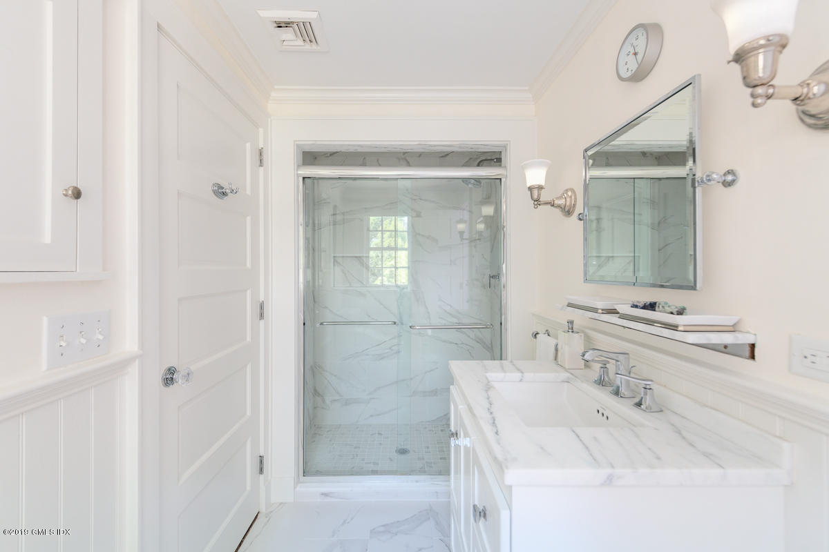 23 Maher Avenue Greenwich, CT 06830 - Photo 26 of 51 a bathroom with a bathtub sink and mirror
