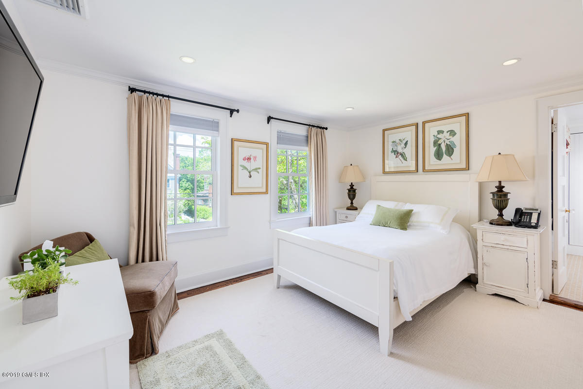 23 Maher Avenue Greenwich, CT 06830 - Photo 27 of 51 a bedroom with a bed and a couch