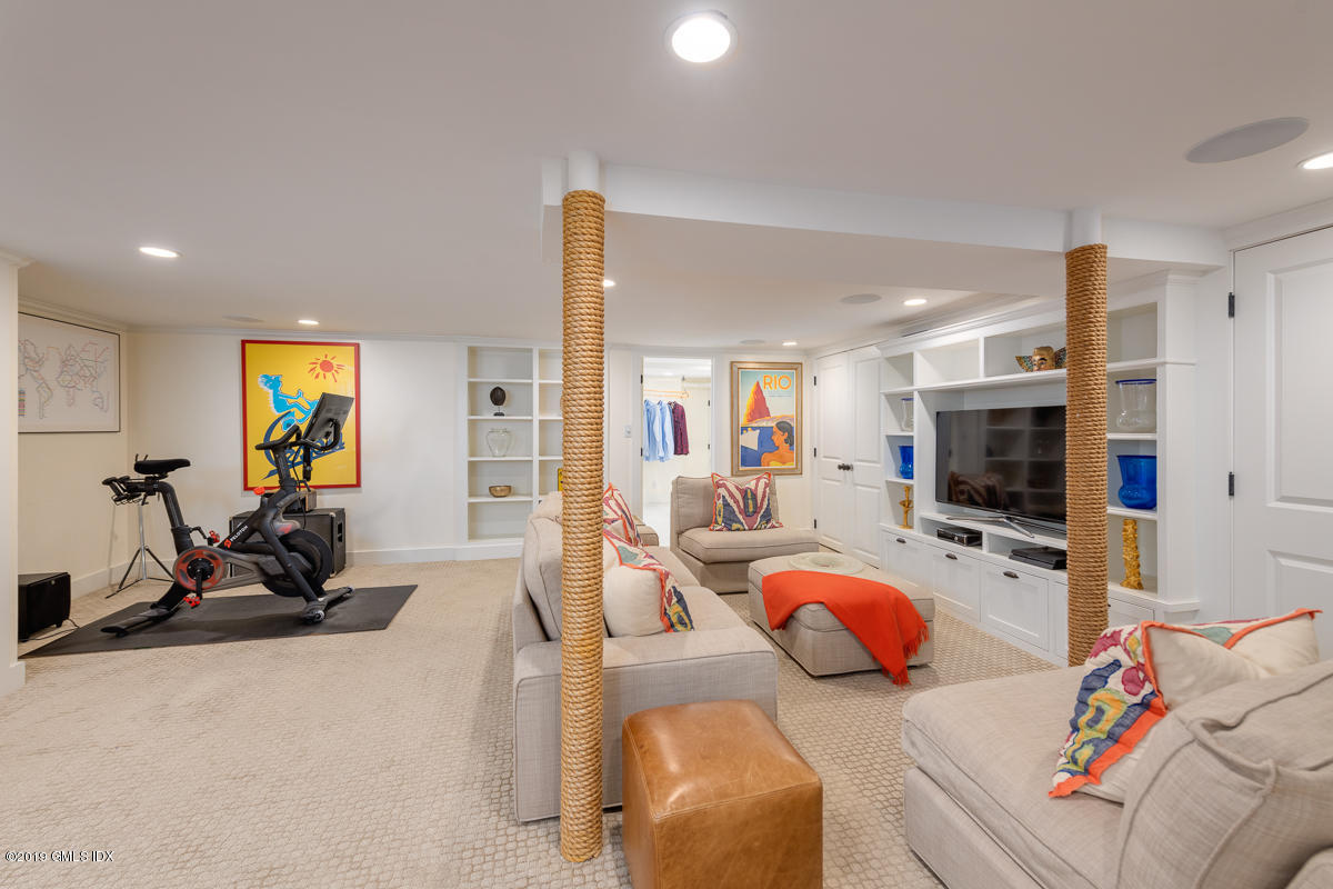 23 Maher Avenue Greenwich, CT 06830 - Photo 39 of 51 a living room with furniture and a flat screen tv