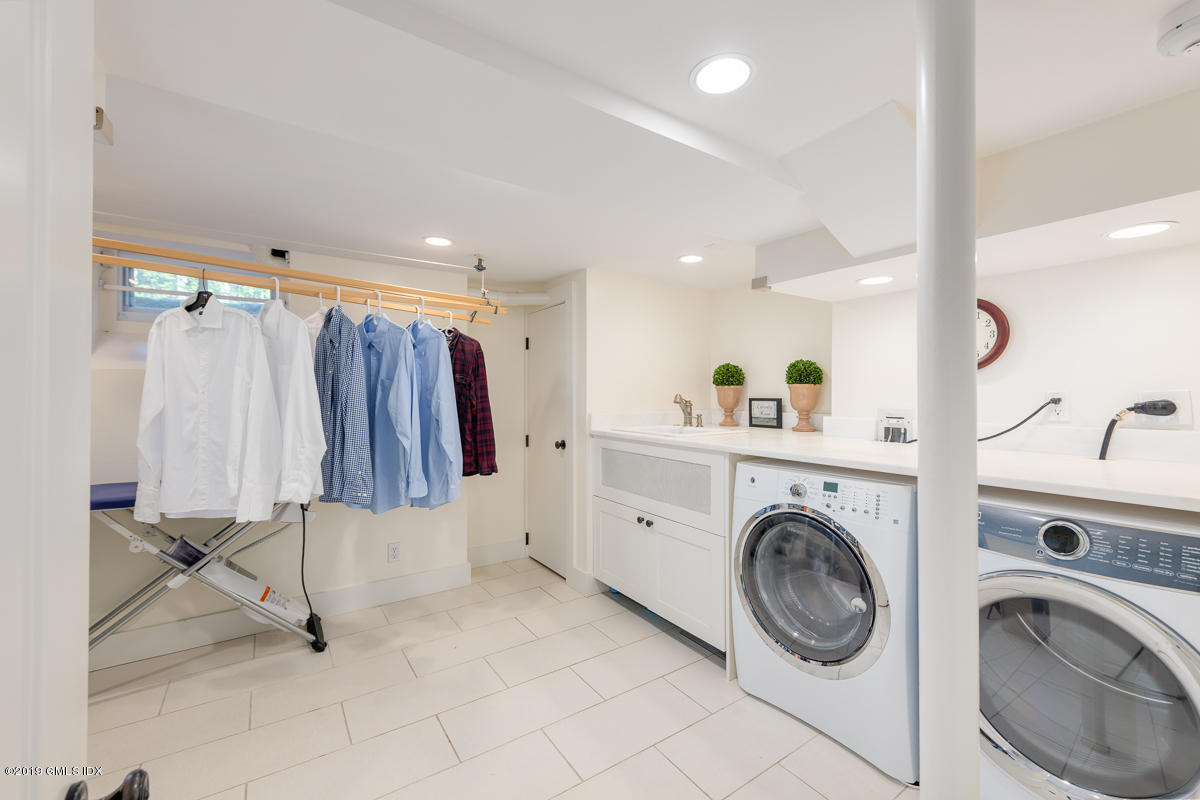 23 Maher Avenue Greenwich, CT 06830 - Photo 41 of 51 a view of storage and utility room with washer and dryer