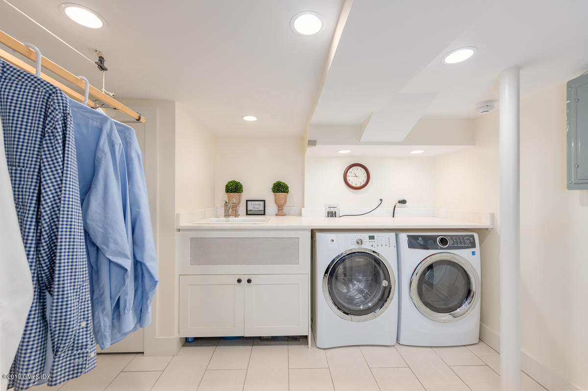 23 Maher Avenue Greenwich, CT 06830 - Photo 42 of 51 a utility room with dryer and washer