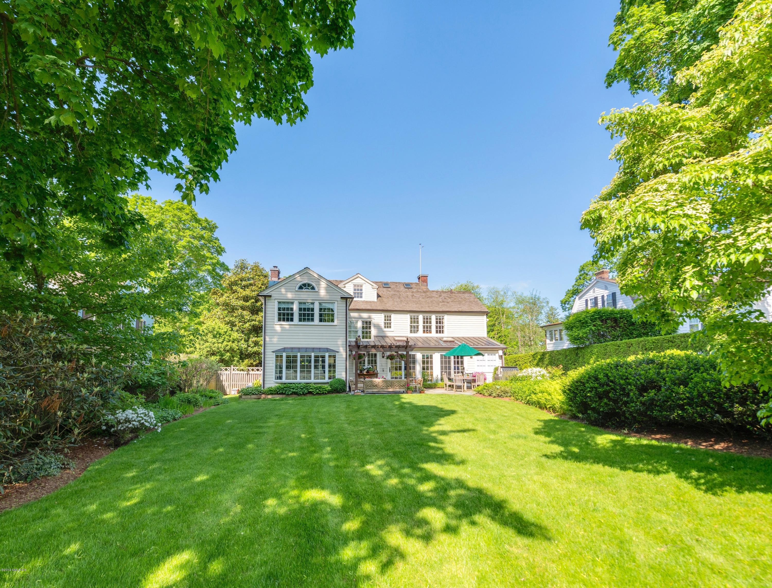 23 Maher Avenue Greenwich, CT 06830 - Photo 46 of 51 a front view of a house with a big yard