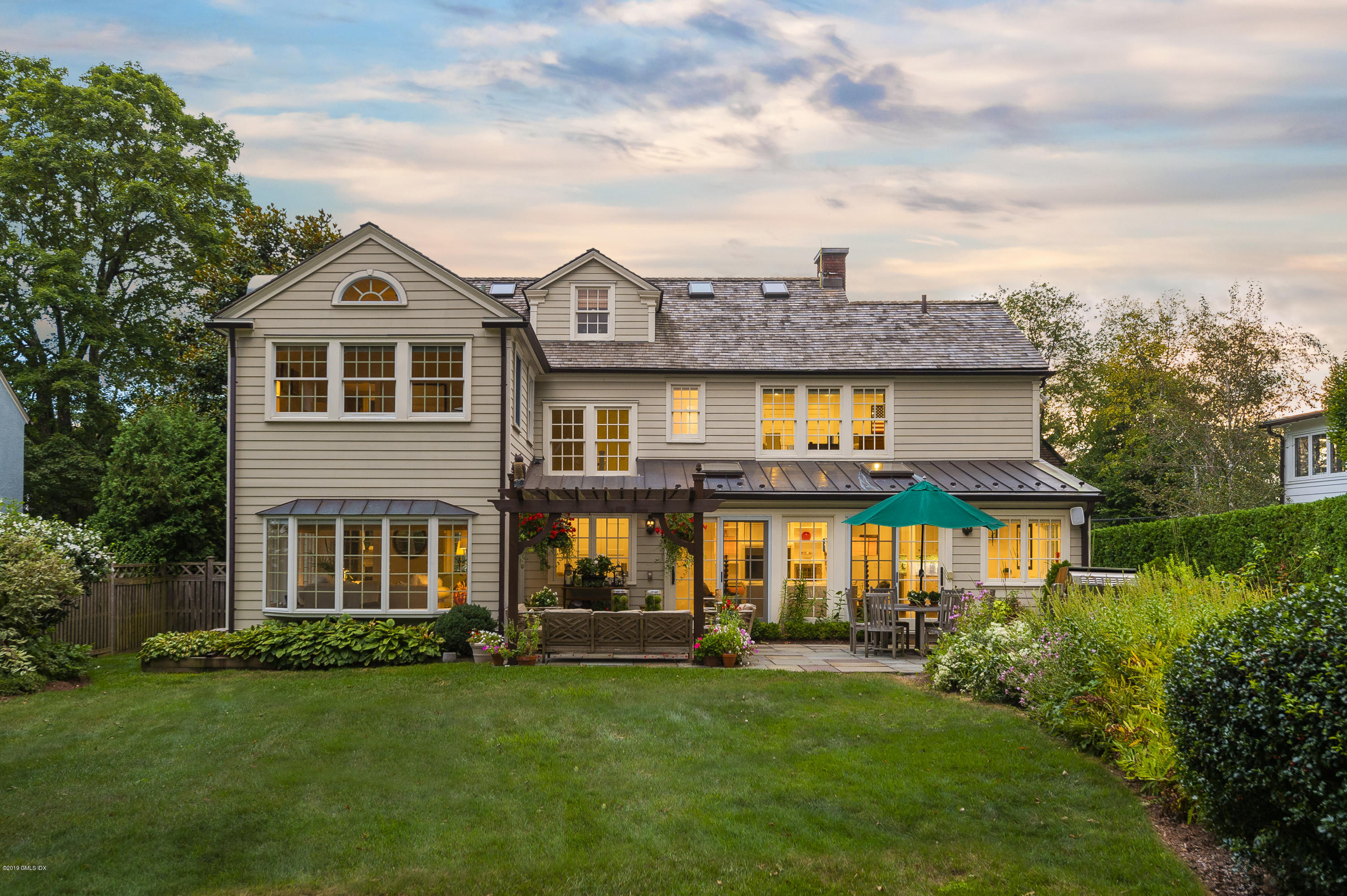 23 Maher Avenue Greenwich, CT 06830 - Photo 47 of 51 a front view of a house with garden