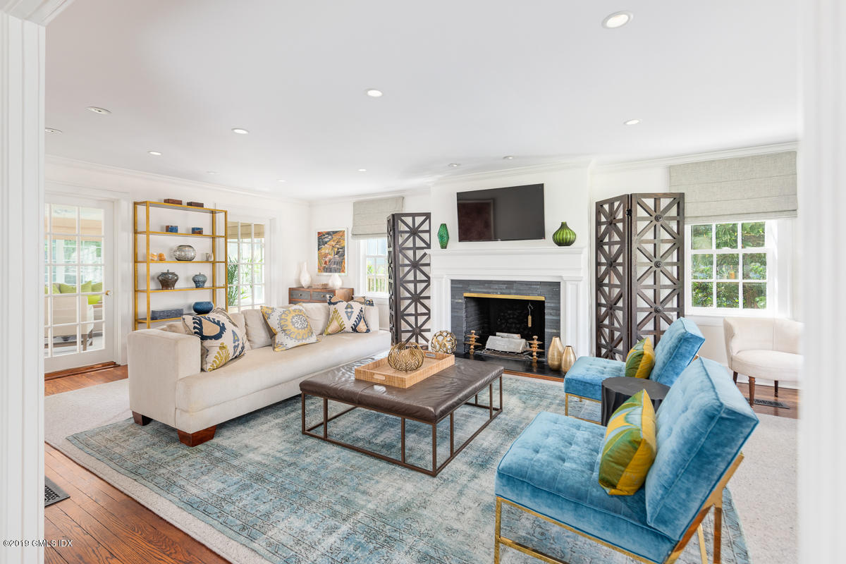 23 Maher Avenue Greenwich, CT 06830 - Photo 7 of 51 a living room with furniture a rug and a fireplace