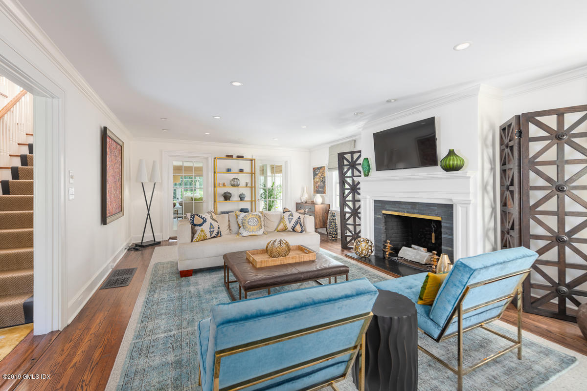 23 Maher Avenue Greenwich, CT 06830 - Photo 8 of 51 a living room with furniture and a fireplace