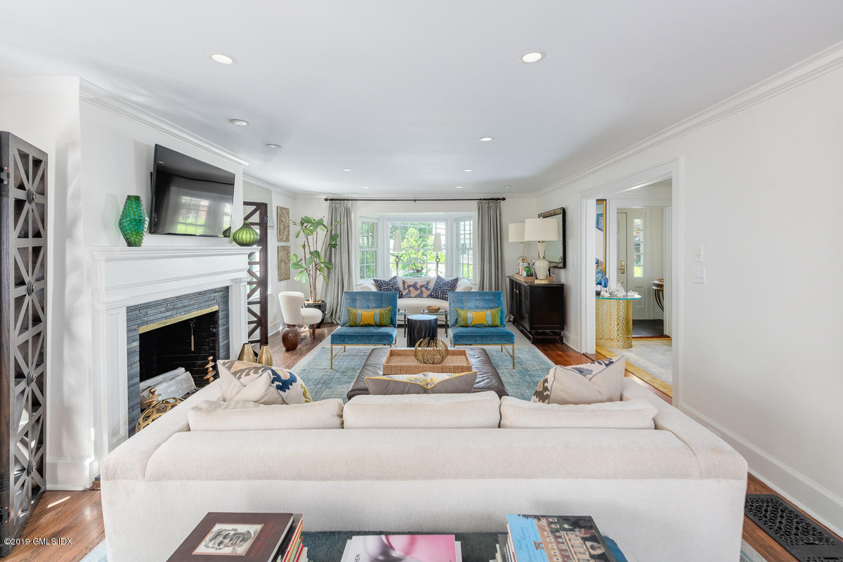 23 Maher Avenue Greenwich, CT 06830 - Photo 9 of 51 a living room with furniture and a fireplace