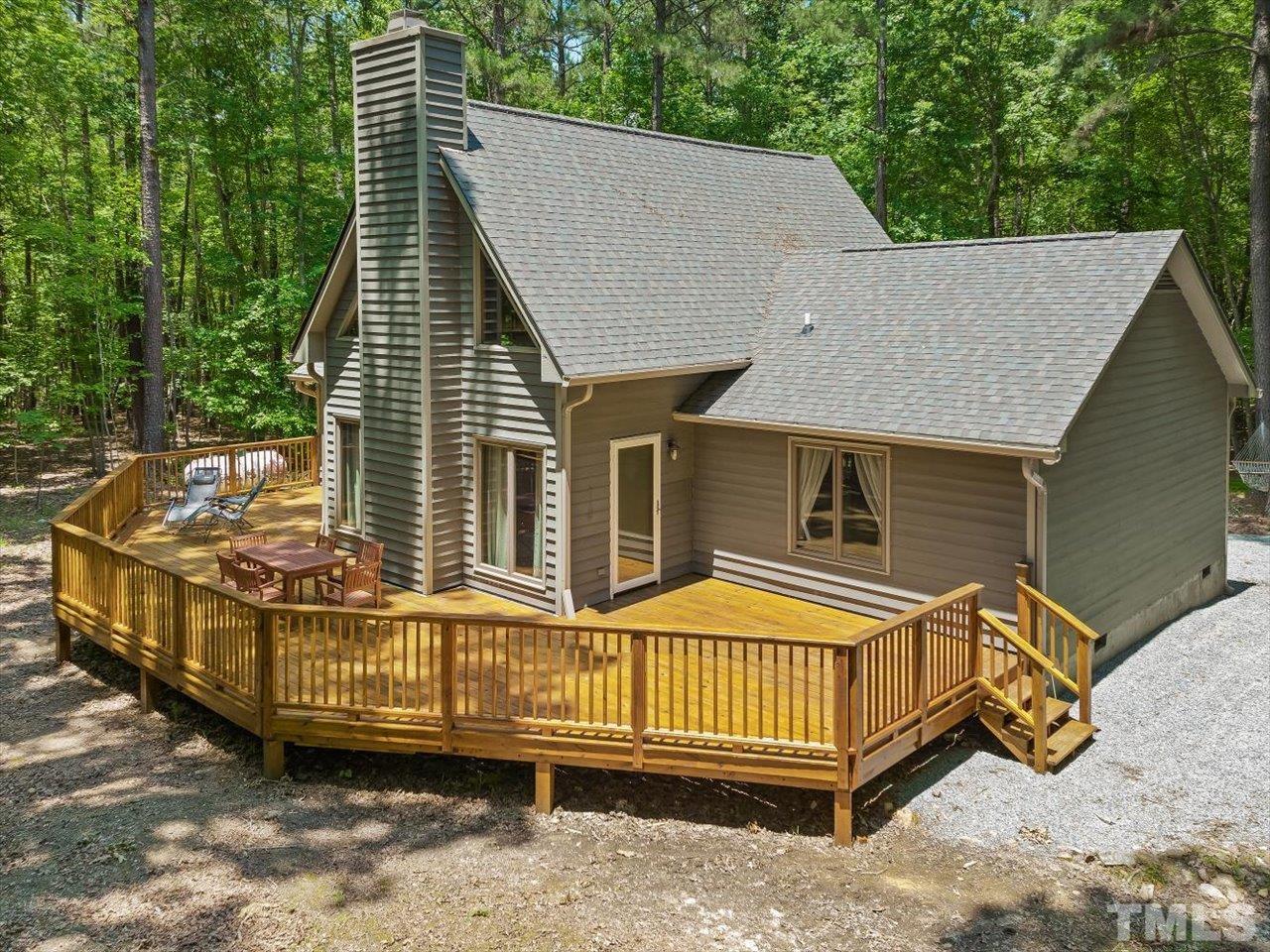 261 Ridge View Pittsboro, NC 27312 - Photo 1 of 57 a view of a house with a wooden deck