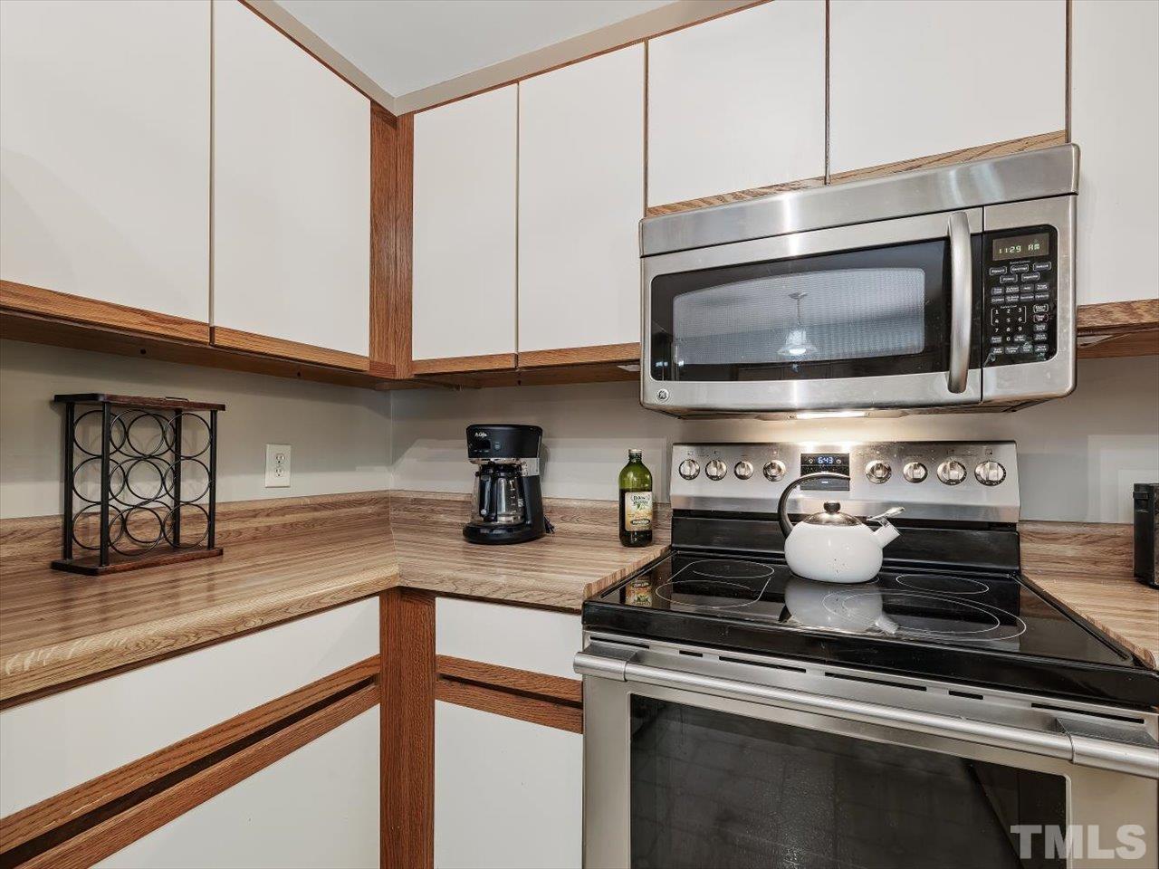 261 Ridge View Pittsboro, NC 27312 - Photo 12 of 57 a kitchen with a stove and a microwave
