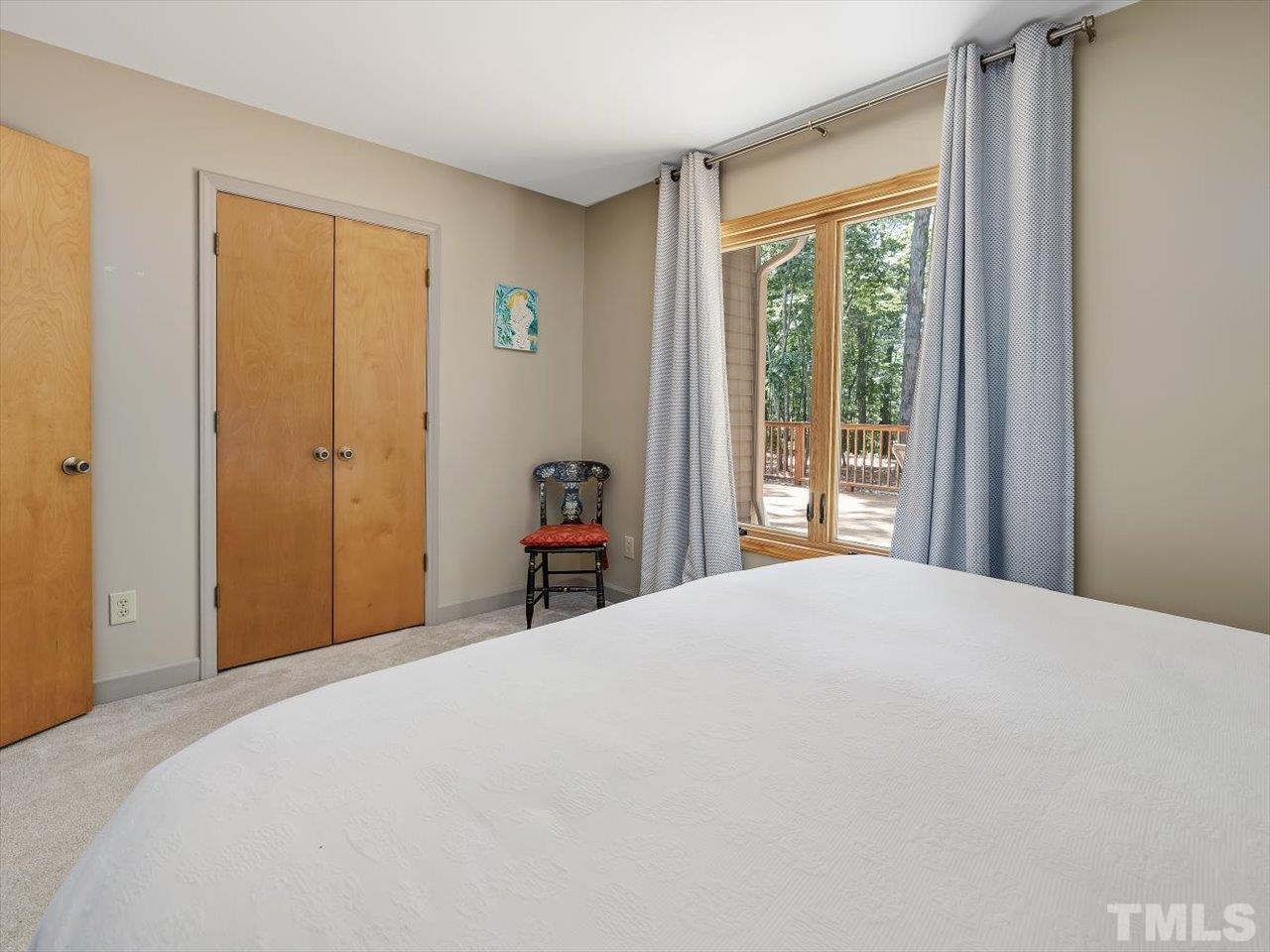 261 Ridge View Pittsboro, NC 27312 - Photo 23 of 57 a bedroom with a bed and a window