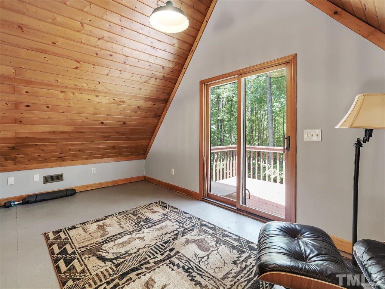 261 Ridge View Pittsboro, NC 27312 - Photo 28 of 57 a view of a bedroom with wooden floor and chair