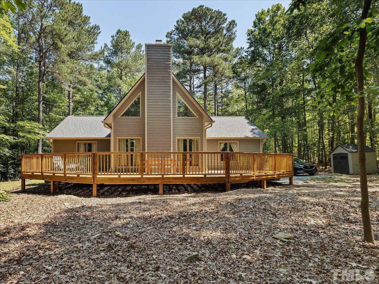 261 Ridge View Pittsboro, NC 27312 - Photo 36 of 57 a view of a house with a yard and wooden fence