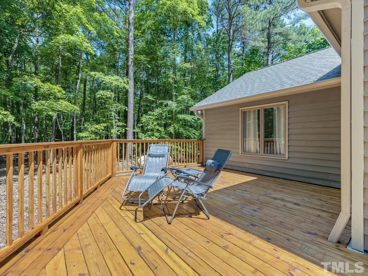 261 Ridge View Pittsboro, NC 27312 - Photo 40 of 57 a view of a deck with chairs and wooden floor