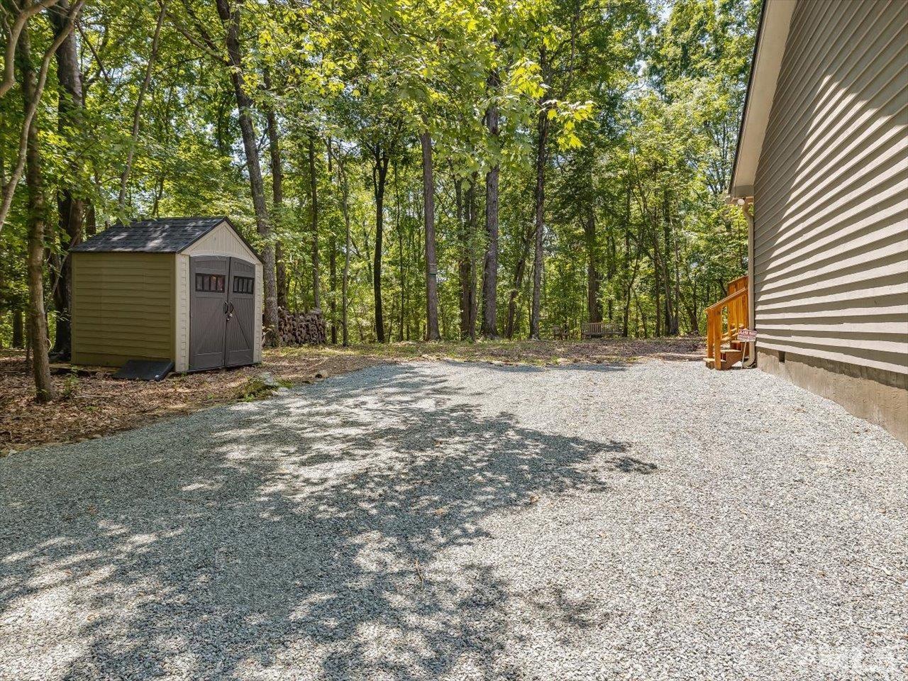 261 Ridge View Pittsboro, NC 27312 - Photo 48 of 57 a front view of a house with a yard and garage