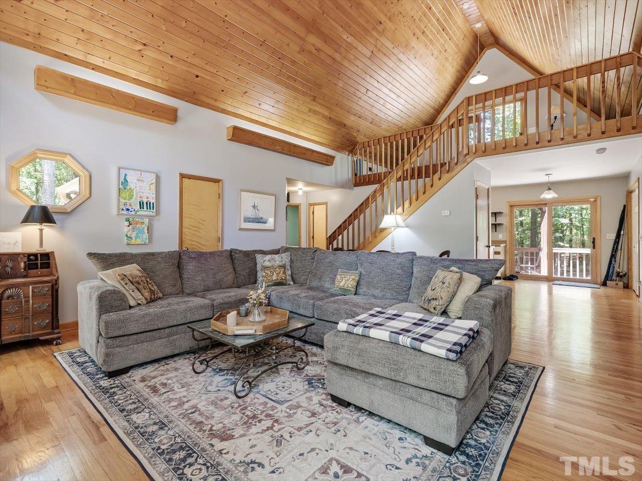 261 Ridge View Pittsboro, NC 27312 - Photo 5 of 57 a living room with furniture a rug and a clock