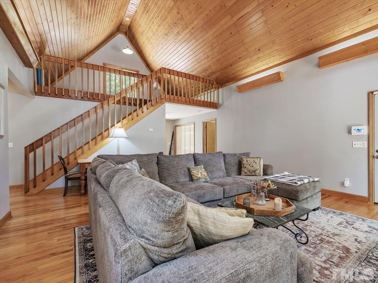 261 Ridge View Pittsboro, NC 27312 - Photo 6 of 57 a living room with furniture or wooden floor and a chandelier
