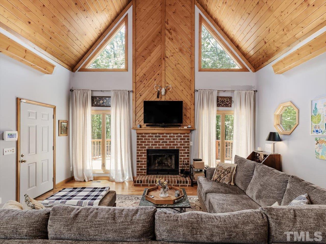 261 Ridge View Pittsboro, NC 27312 - Photo 7 of 57 a living room with furniture a fireplace and a window