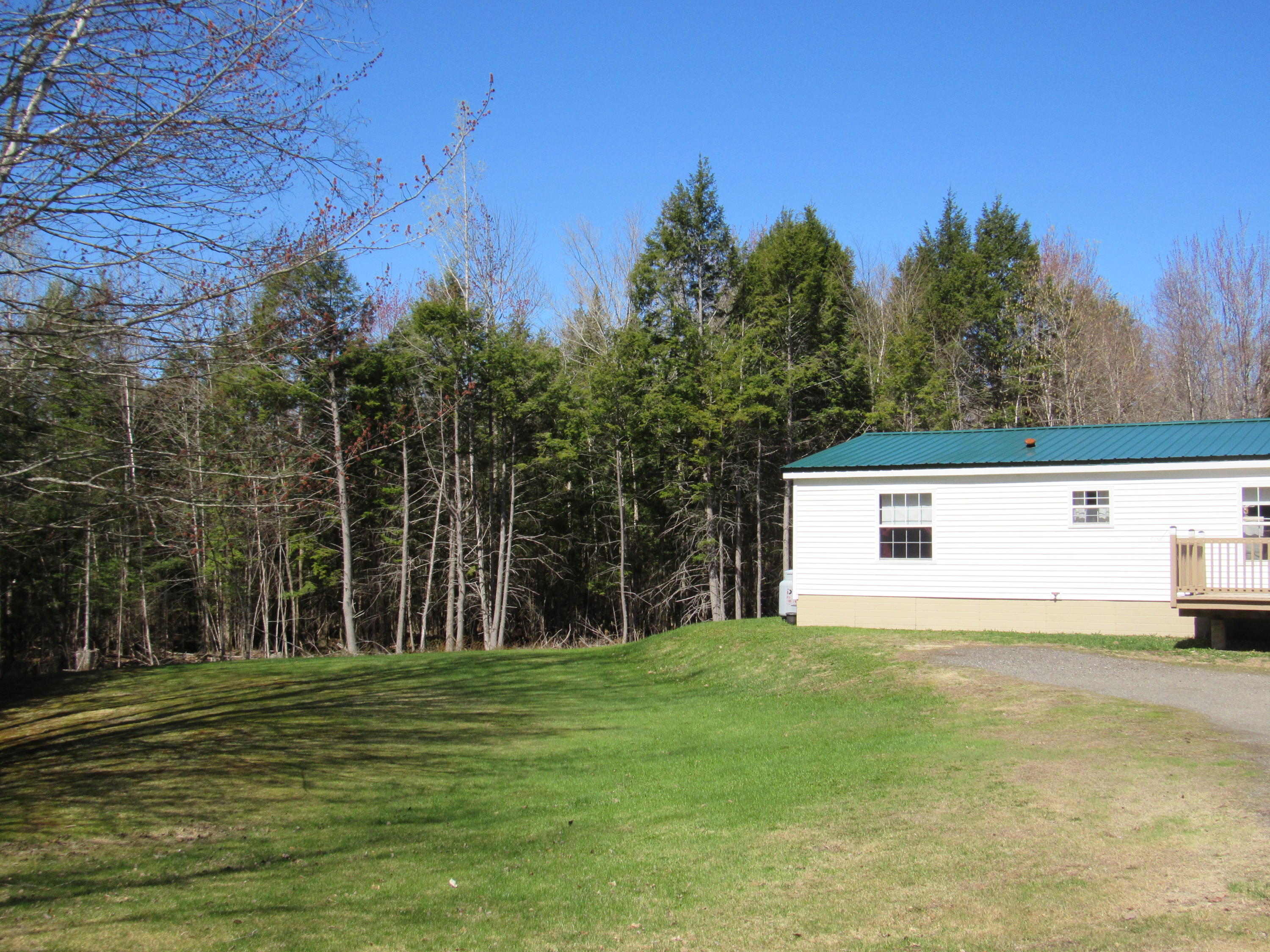 419 Mccard Road Corinth, ME 04427 - Photo 43 of 56 west side yard