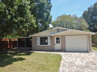 3923 Rockefeller Avenue Sarasota, FL 34231 - Photo 1 of 1 a backyard of a house with yard and tree
