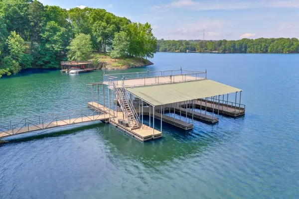 an aerial view of a house with swimming pool and outdoor space