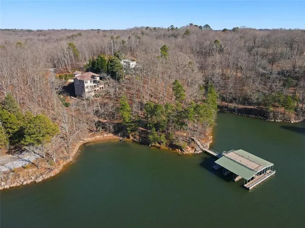 a aerial view of a house with a yard