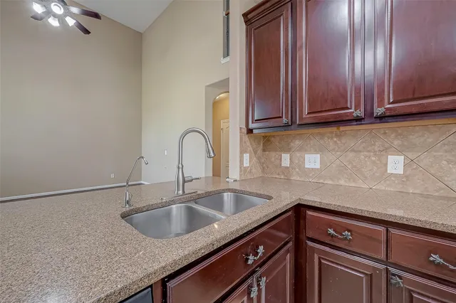 a kitchen with a sink and cabinets