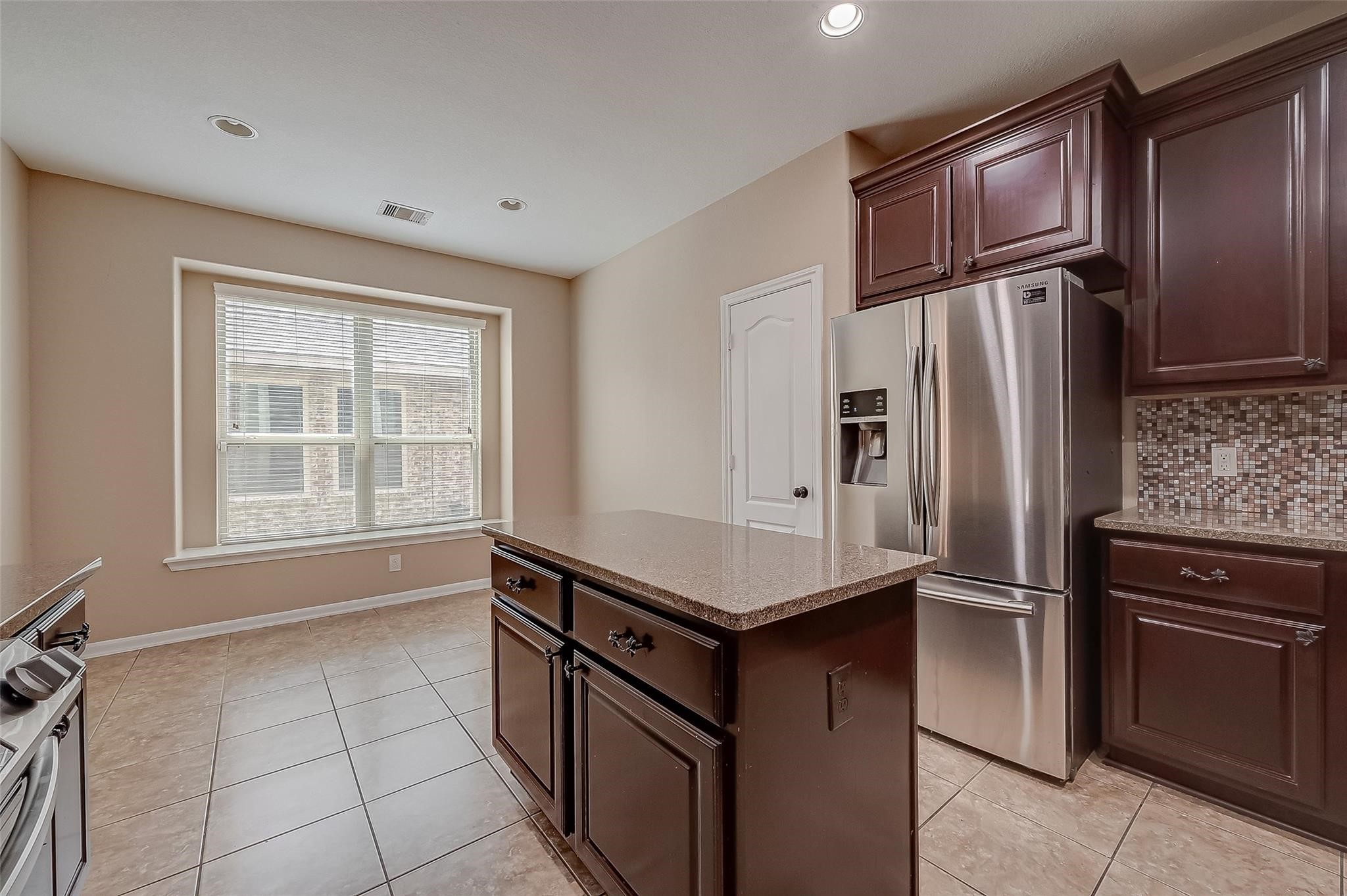21831 Mount Hunt Drive Spring, TX 77388 - Photo 21 of 47 a kitchen with stainless steel appliances granite countertop a refrigerator and a sink