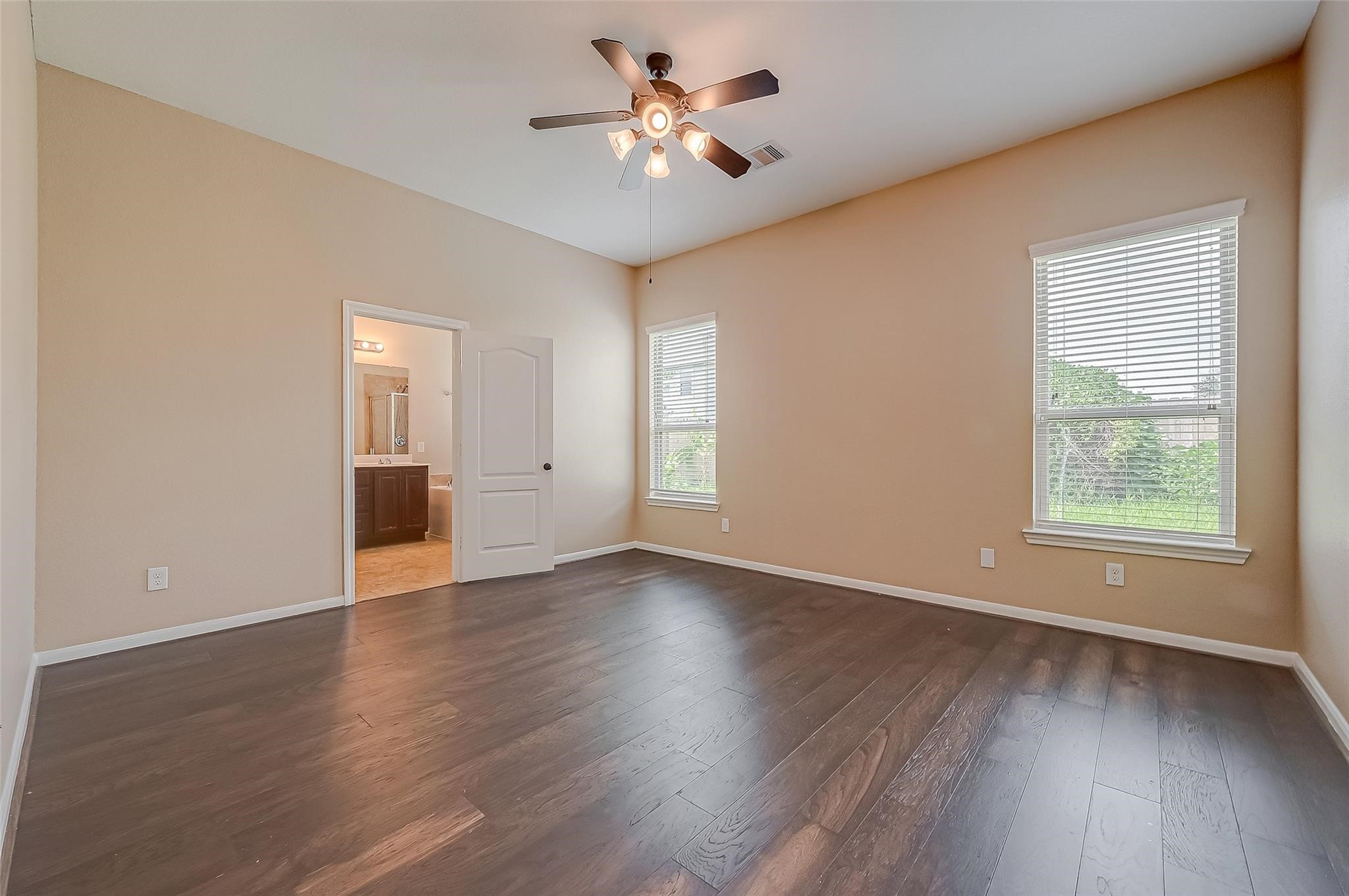 21831 Mount Hunt Drive Spring, TX 77388 - Photo 28 of 47 an empty room with wooden floor and windows