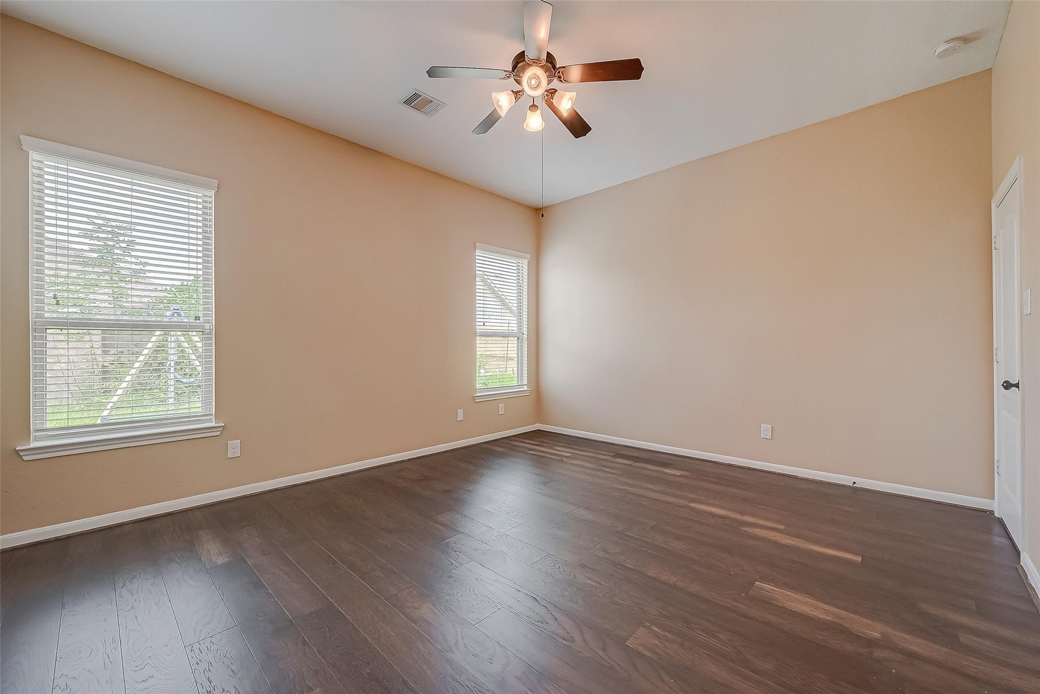 21831 Mount Hunt Drive Spring, TX 77388 - Photo 31 of 47 a view of an empty room with window and wooden floor