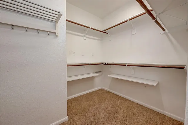 a view of an empty walk in closet